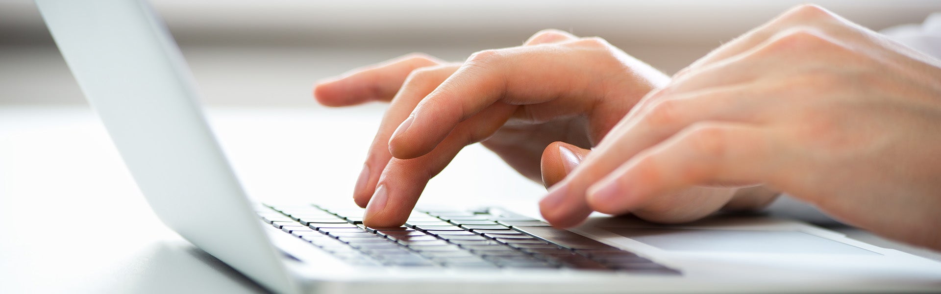 Person typing on a laptop